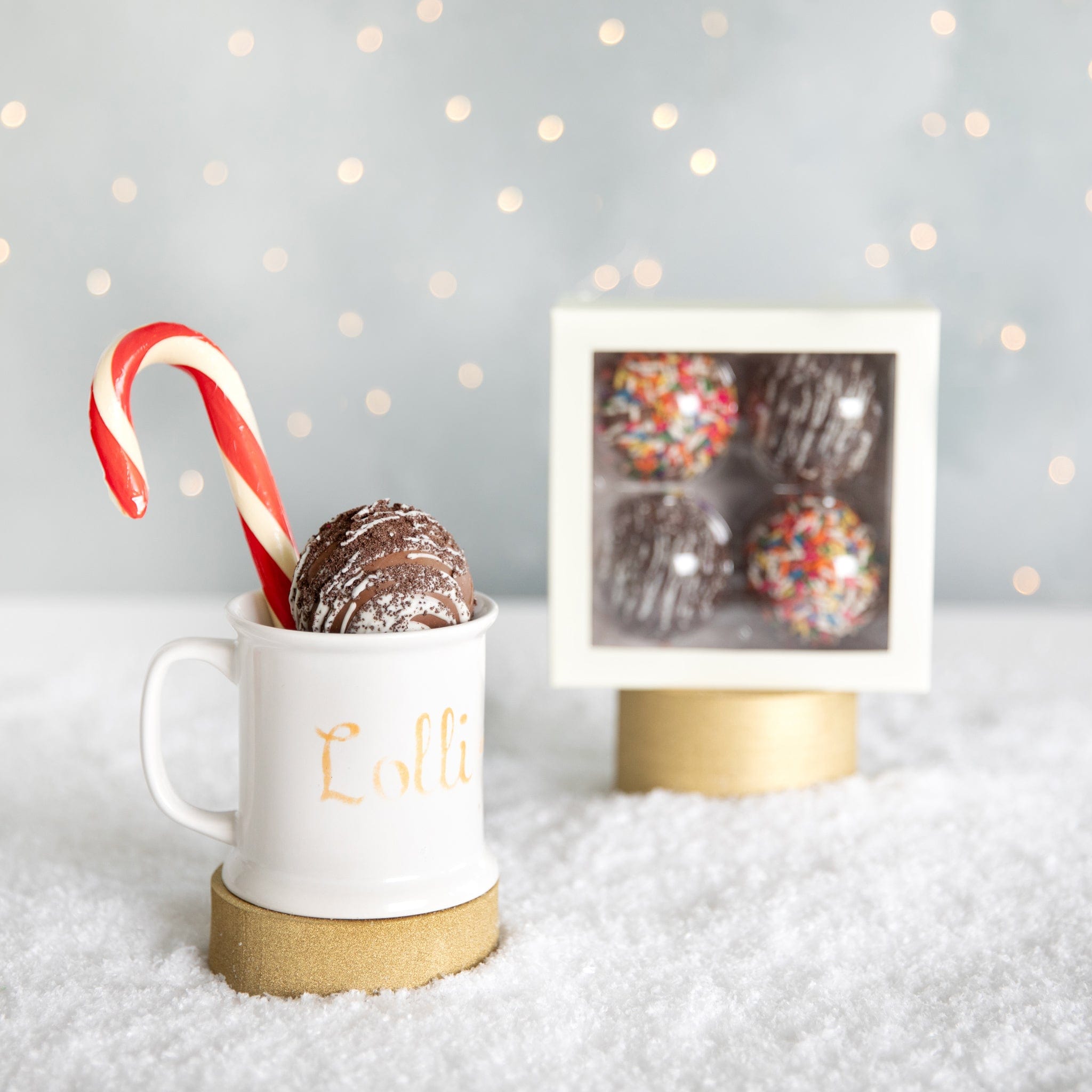 https://www.lolliandpops.com/cdn/shop/files/lolli-and-pops-l-p-collection-cake-cookie-hot-cocoa-bombs-34758857392328_2048x.jpg?v=1702059117